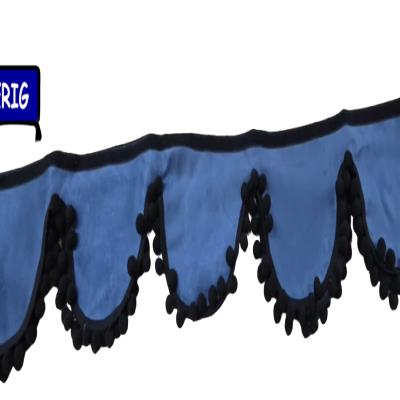 ShoA sleek blue truck pelmet finished with stylish black pom pom trim for a clean, modern cab interior. Whiterig Truck Curtains